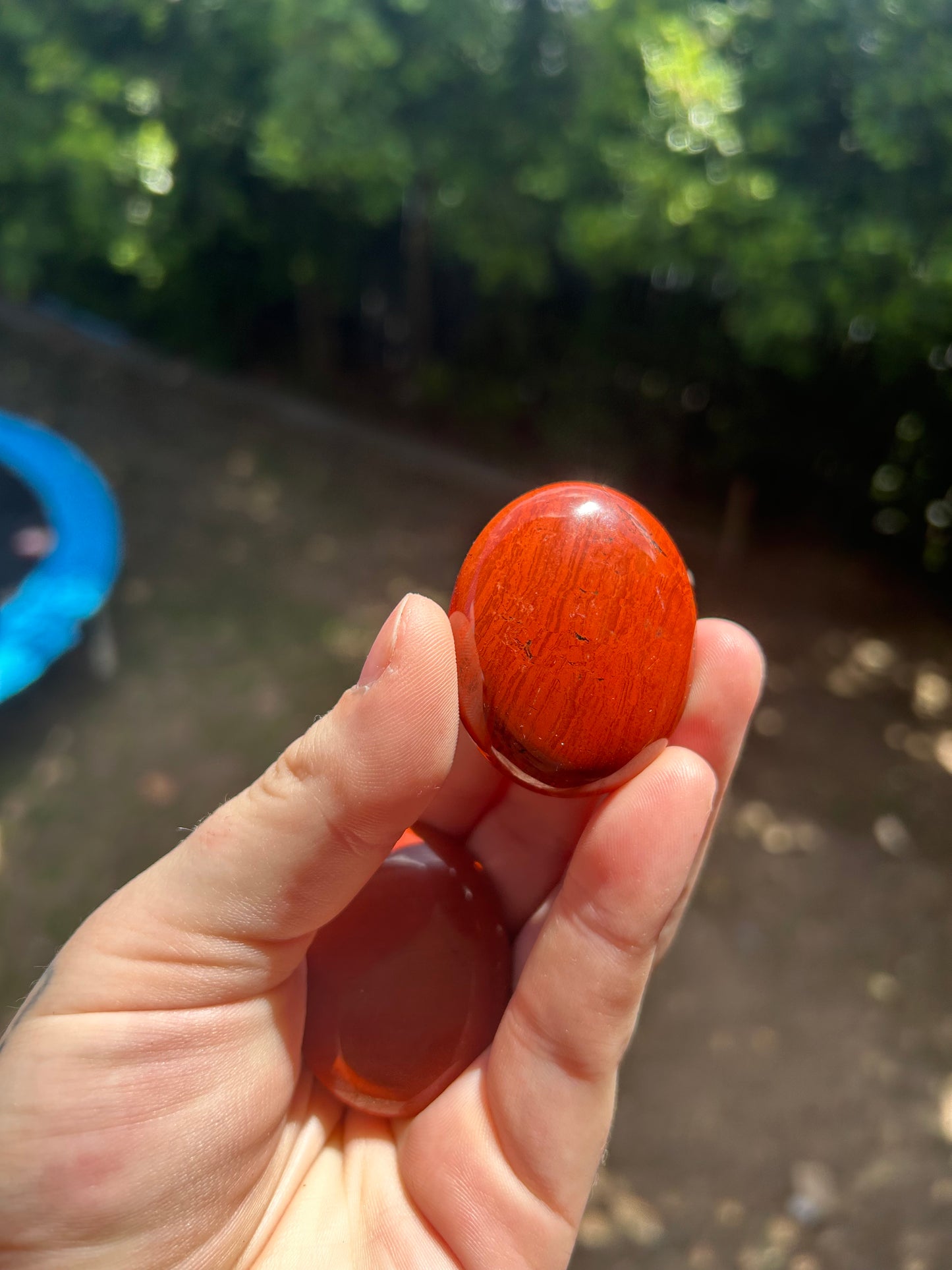 Red jasper palm stone